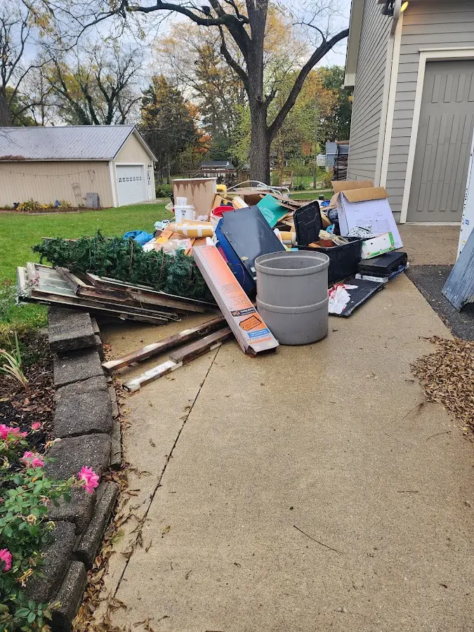 Dumpster being loaded with debris for Demolition Dumpster Rental in West Amwell